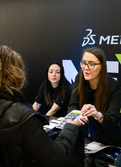 Delegates being helped at a registration and help desk