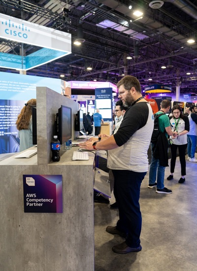 A man using a keyboard at the Spot by NextApp tradeshow stand